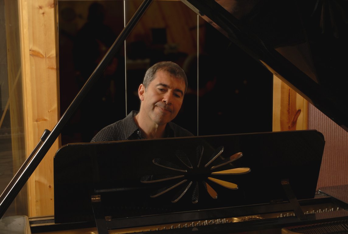 Jimmy White sitting at the piano during a recording session.